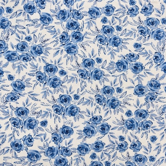 Blue roses and leafy sprigs on white.